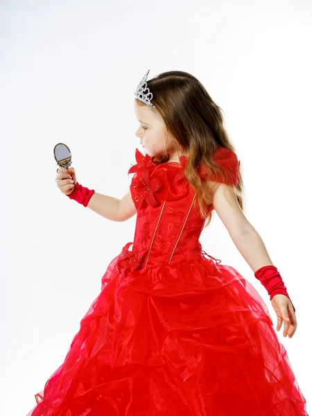 Cute little princess dressed in red isolated on white background — Stock Photo, Image