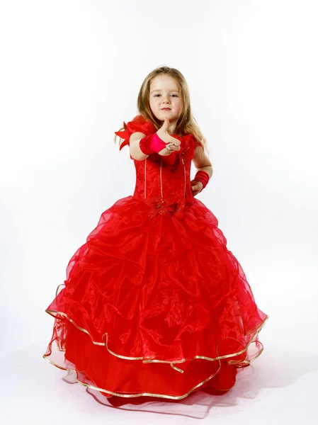 Menina bonito vestido de vermelho posando em estúdio — Fotografia de Stock