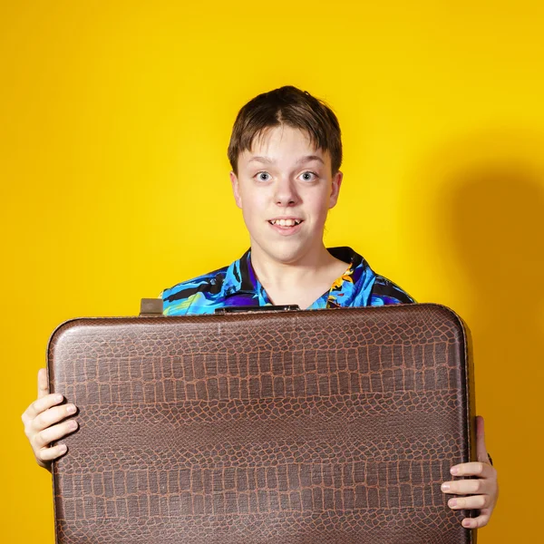 Affective teenage boy with retro suitcase — Stock Photo, Image