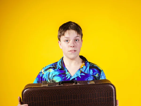 Affective teenage boy with retro suitcase — Stock Photo, Image