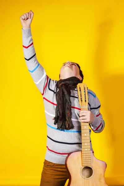 Affective teenage boy with guitar. Music concept. — Stock Photo, Image