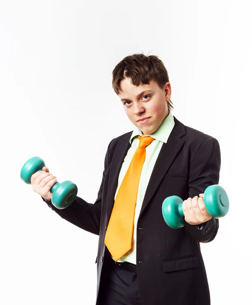 Teenage boy dressed in office suit doing sport exercises — Stock Photo, Image