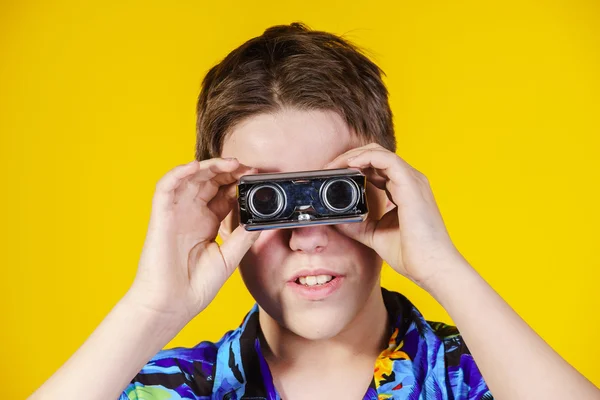 Teenage boy with opera binocular close-up portrait — Stock Photo, Image