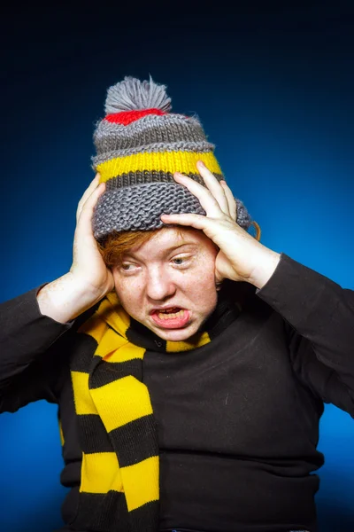 Expressive teenage boy dressed in colorful hat close-up portrait — Stock Photo, Image