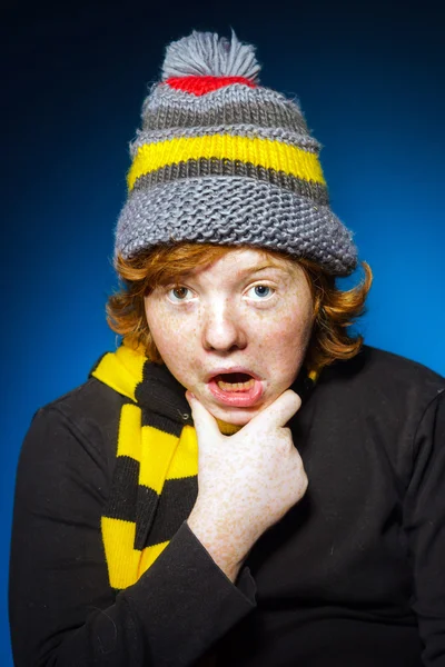 Expressive teenage boy dressed in colorful hat close-up portrait — Stock Photo, Image