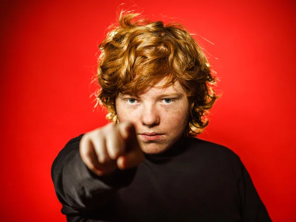 Expressive red-haired teenage boy showing emotions in studio — Stock Photo, Image