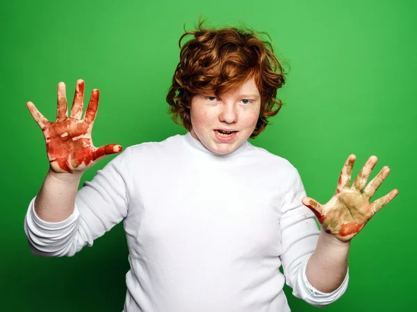 Expressive boy showing colorful hands after drawing — Stock Photo, Image