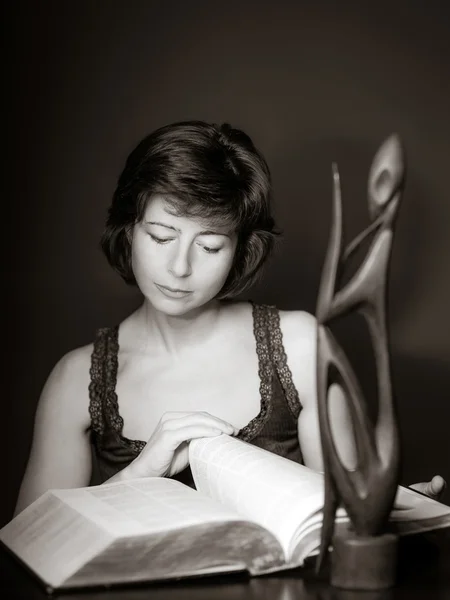 Young woman reading big book, concentration and attentiveness — Stock Photo, Image