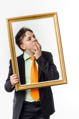 Expressive teenage boy posing with picture frame clipart