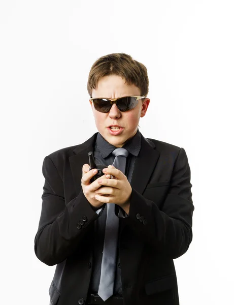Teenage boy posing like a guardsman with radio transmitter — Stock Photo, Image