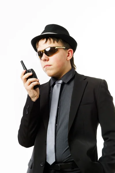 Teenage boy posing like a guardsman with radio transmitter — Stock Photo, Image