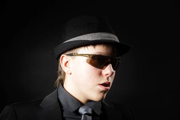 Affective teenage boy dressed in strong suit — Stock Photo, Image