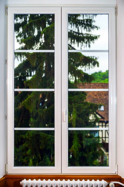 Big pvc window with decoration elements in old french house — Stockfoto