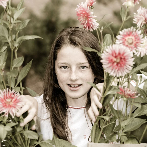 Teenage schoolgirl portrait with natural flowers — Stock Photo, Image