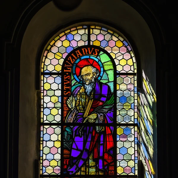 Sun light through the leaded pane in old majestic church — Stock Photo, Image