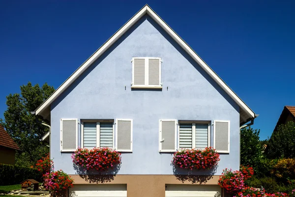 Classic french village house renovated and decorated by flowers — Stock Photo, Image