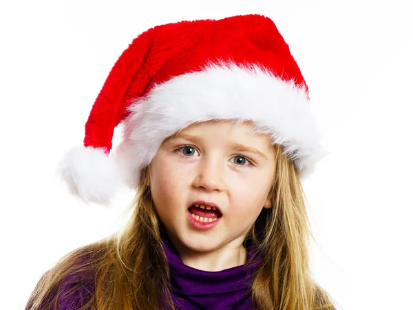 Cute little preschooler girl in red santa hat with gift box — Zdjęcie stockowe