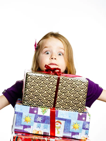 Cute little preschooler girl in red santa hat with gift box — Zdjęcie stockowe