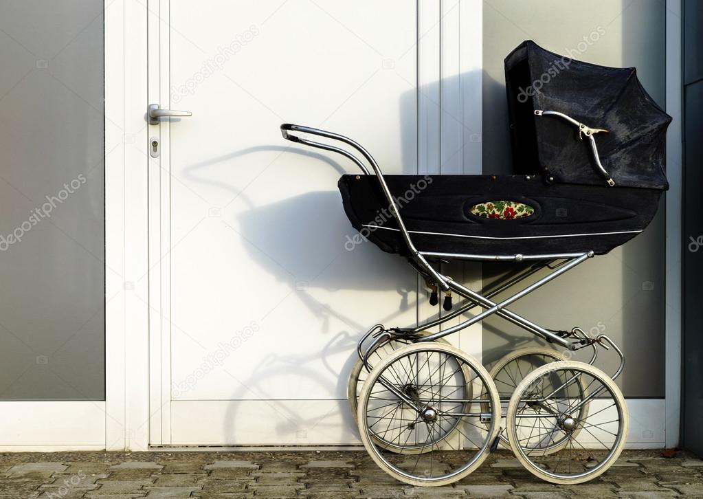 Retro style stroller baby carriage outdoors 