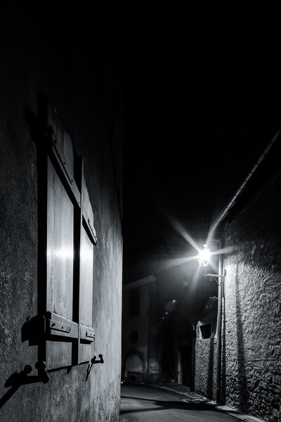Old medieval french village street, night view, Dambach-la-Ville