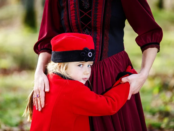 Cute little girl cuddling to her mother — Stock Photo, Image