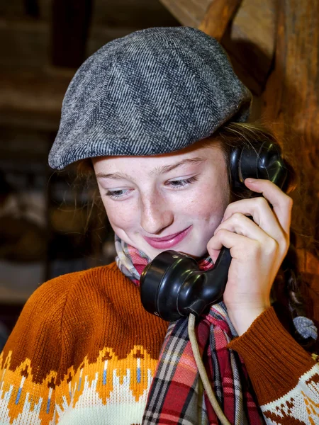 Teenage girl speaking by old vintage telephone — Stock Photo, Image