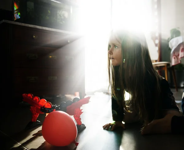 Little girl playing in children room — Stock Photo, Image