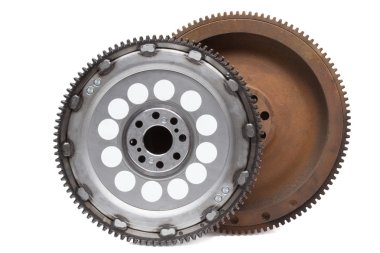 new and old rusty damping flywheels for automotive diesel engines on a white. car parts