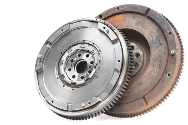 new and old rusty damping flywheels for automotive diesel engines on a white. car parts