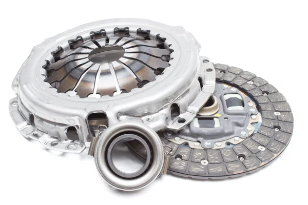 A new set of replacement automotive clutch on a white. Disc and clutch basket with release bearing — 스톡 사진