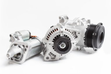 starter, alternator / generator and air conditioning compressor isolated on white background