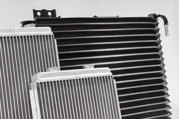 Radiator engine cooling and passenger compartment heating