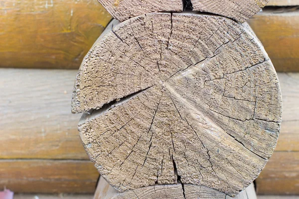 Beginning of rural house construction from heavy logs against blue sky with white clouds in summer day — Stock Photo, Image