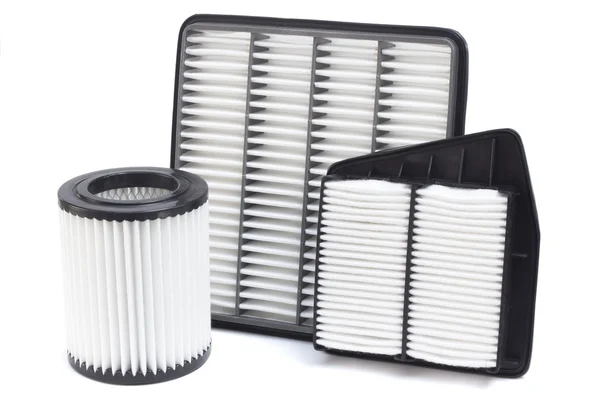Composizione di filtri aria per motore auto su fondo bianco — Foto Stock