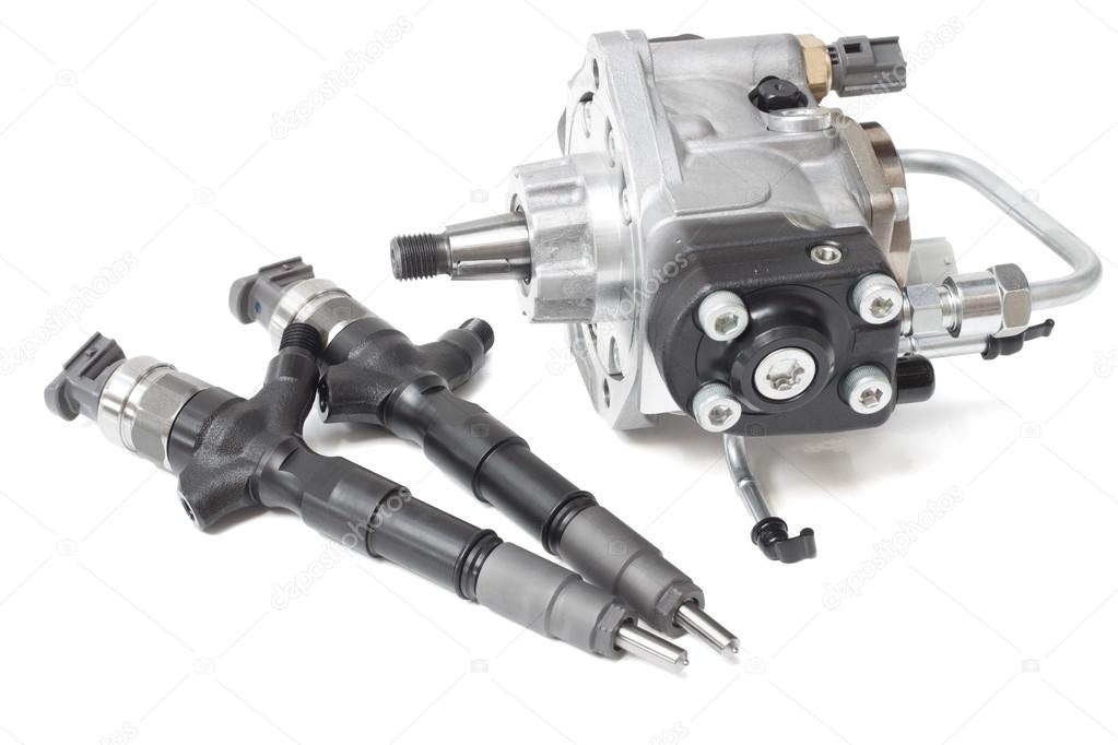 new solenoid injectors for diesel fuel lying on a white background with a rod and a fuel injection pump