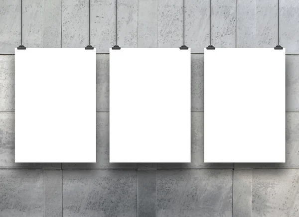 Three hanged paper sheets with clips on lamina — Stock Photo, Image