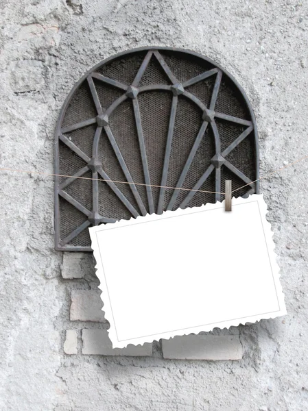 Single hanged postcard on ancient metal window — Stock Photo, Image
