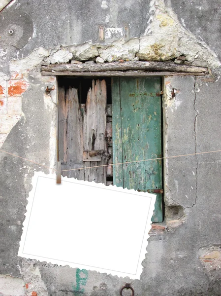 One hanged postcard on damaged window — Stock Photo, Image