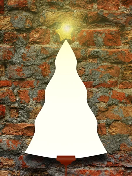 Single Christmas tree shaped frame with turned on star on brick wall — Stock Photo, Image