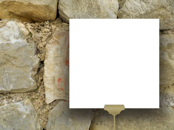 Enkel hängd fyrkantig ram på antika stenmuren — Stockfoto