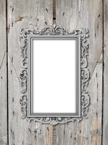 Single silver plated baroque frame on wooden boards — Stock Photo, Image
