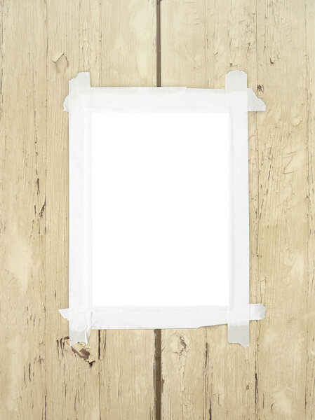 Single frame with tape on brown wooden boards background