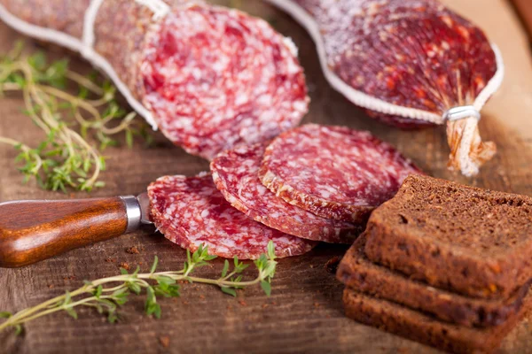 Juicy sausage dish on a natural background. — Stock Photo, Image