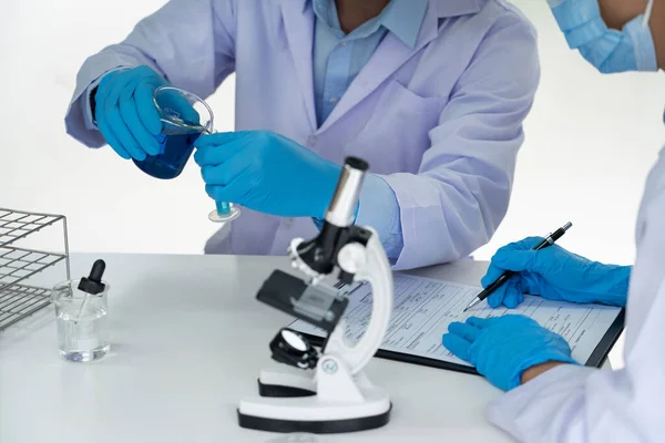 Attractive Young Scientist Team Lab Coat Safety Goggles Working Analysing — Stock Photo, Image