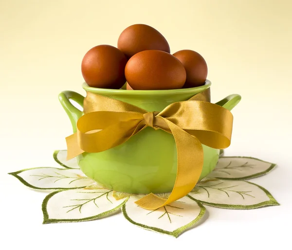 Easter greeting card - easter eggs in basket — Stock Photo, Image