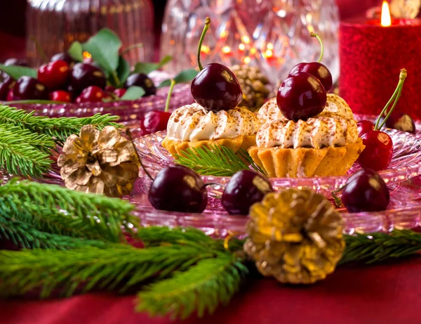 Christmas dessert - cupcakes with red berries cherries