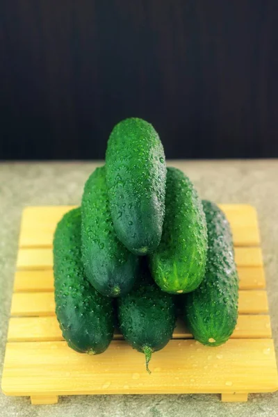 Vertical Photo Shows Image Fresh Vegetables Green Ripe Cucumbers Wooden — Stock Photo, Image