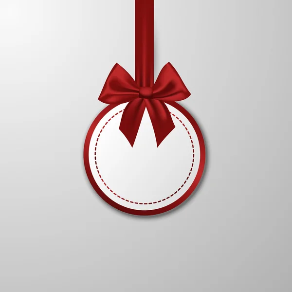 Christmas paper bauble with bow on the white background. — Stock Vector