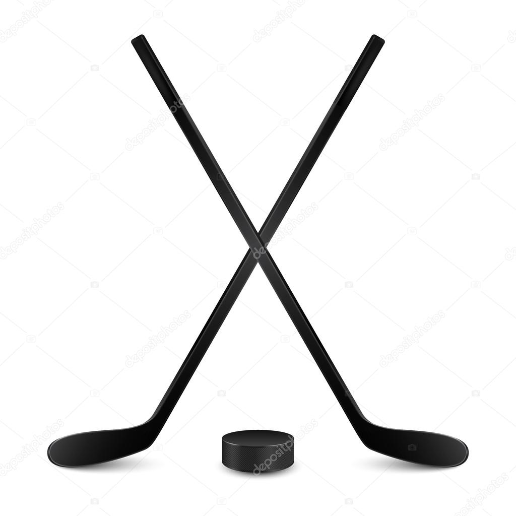 Two crossed hockey sticks and puck. Isolated on white