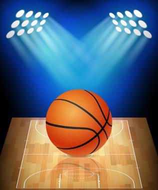 Basketbol sahası ile sahne ışıkları üzerinde topu